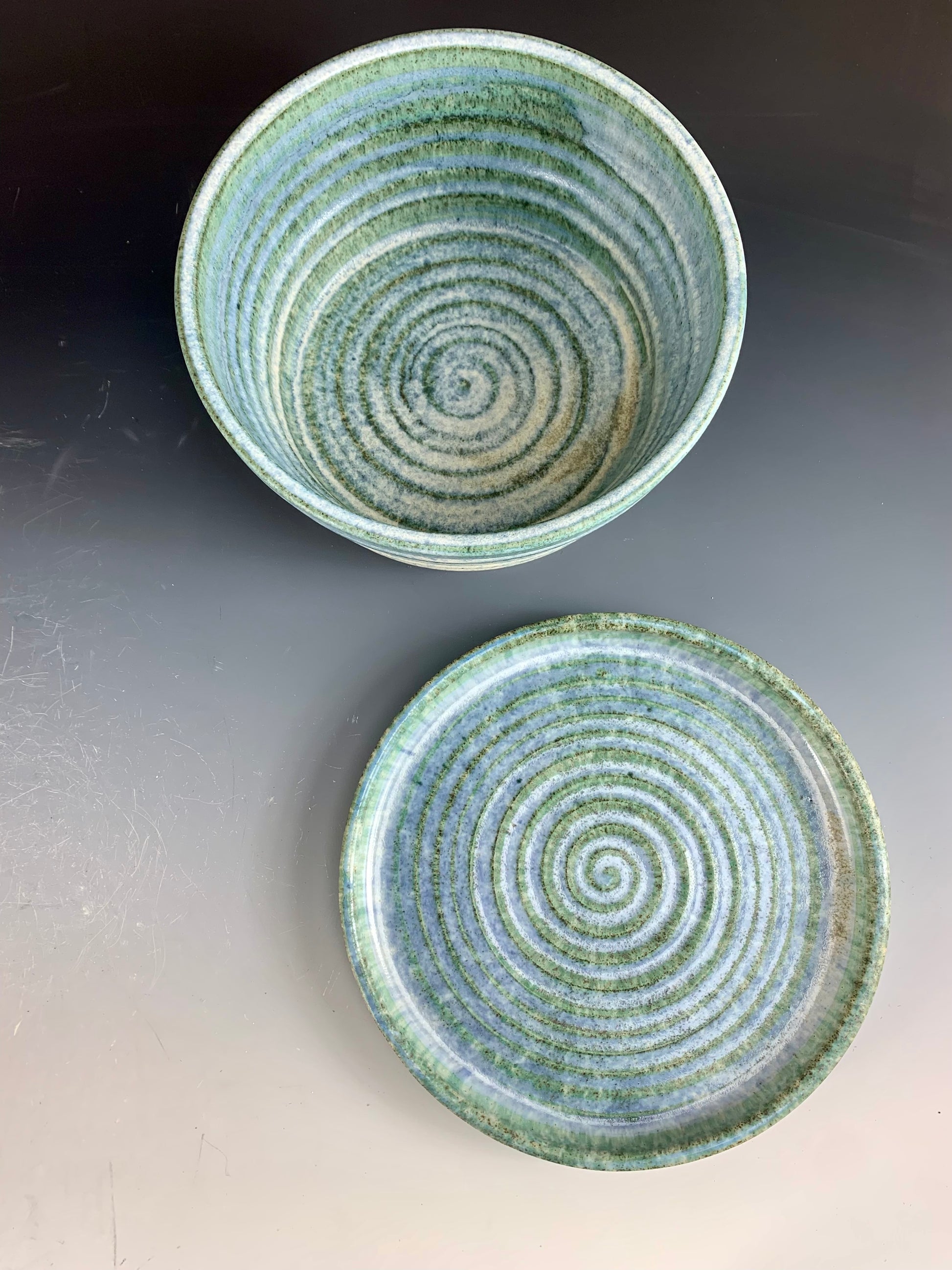 Above view of Blue and White storage container on dark background, lid off