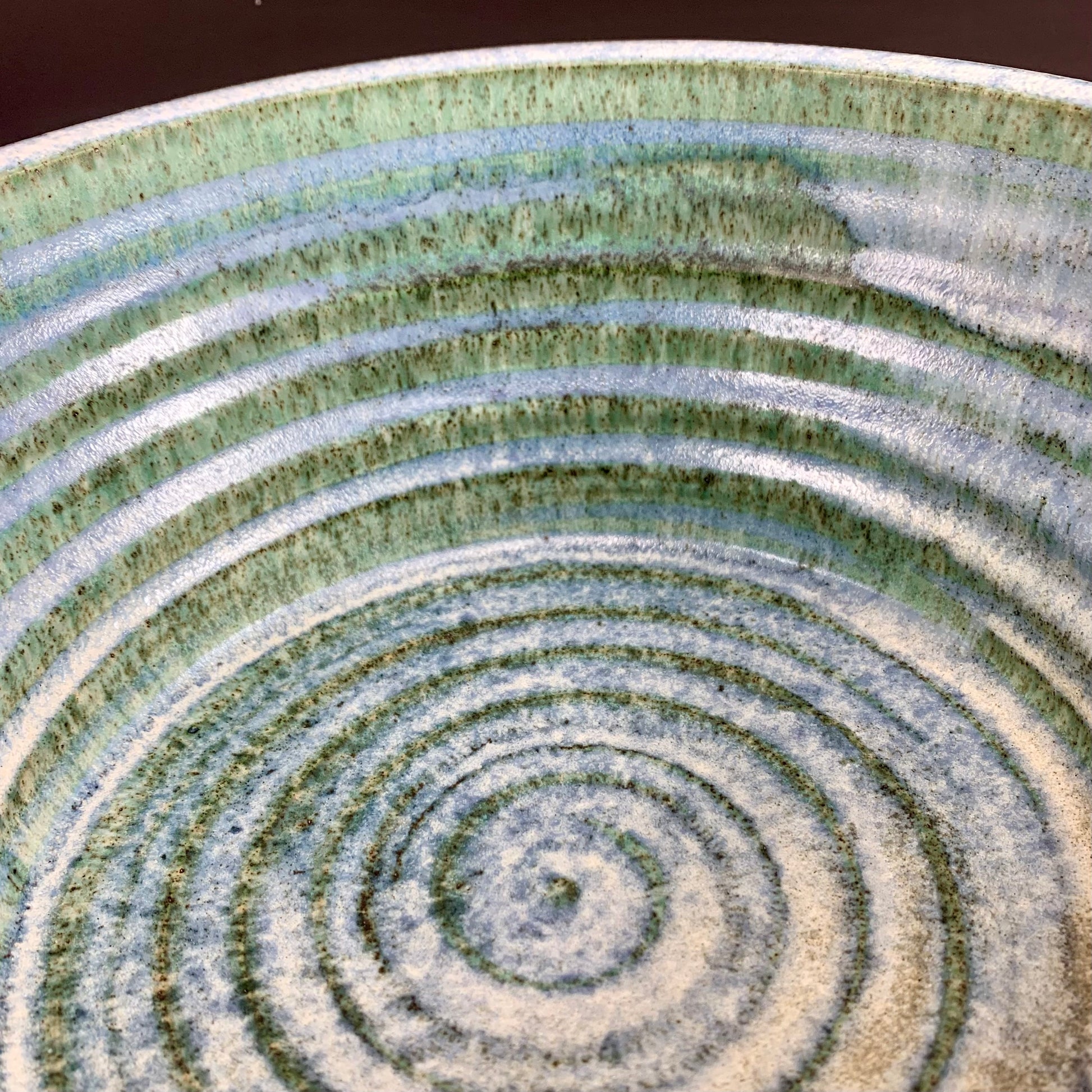 Inside view  of Blue and White storage container on dark background, lid off