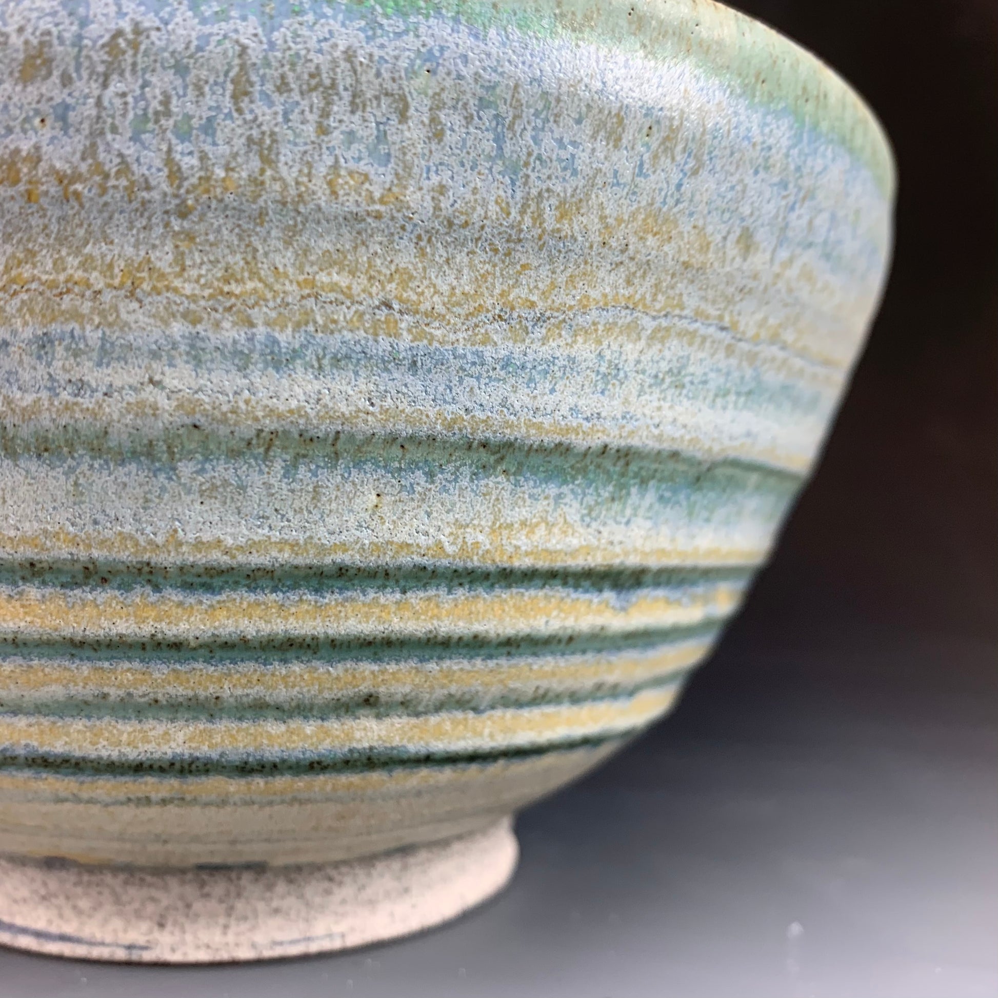 Detail of Blue Ramen Bowl on Dark Background