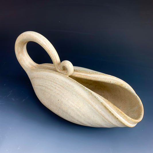 Side view of handmade yellow watering can for plants