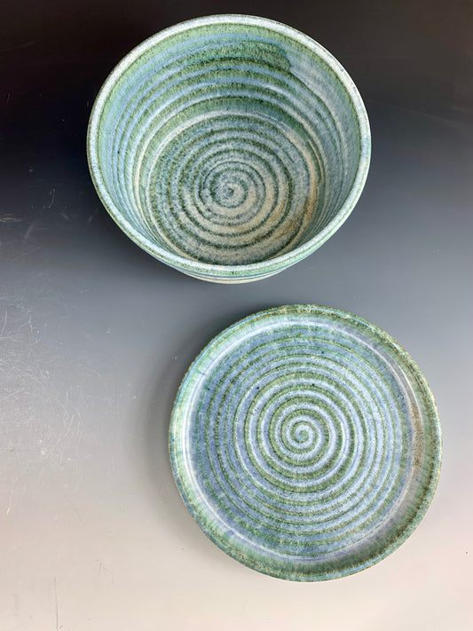 Above view of Blue and White storage container on dark background, lid off