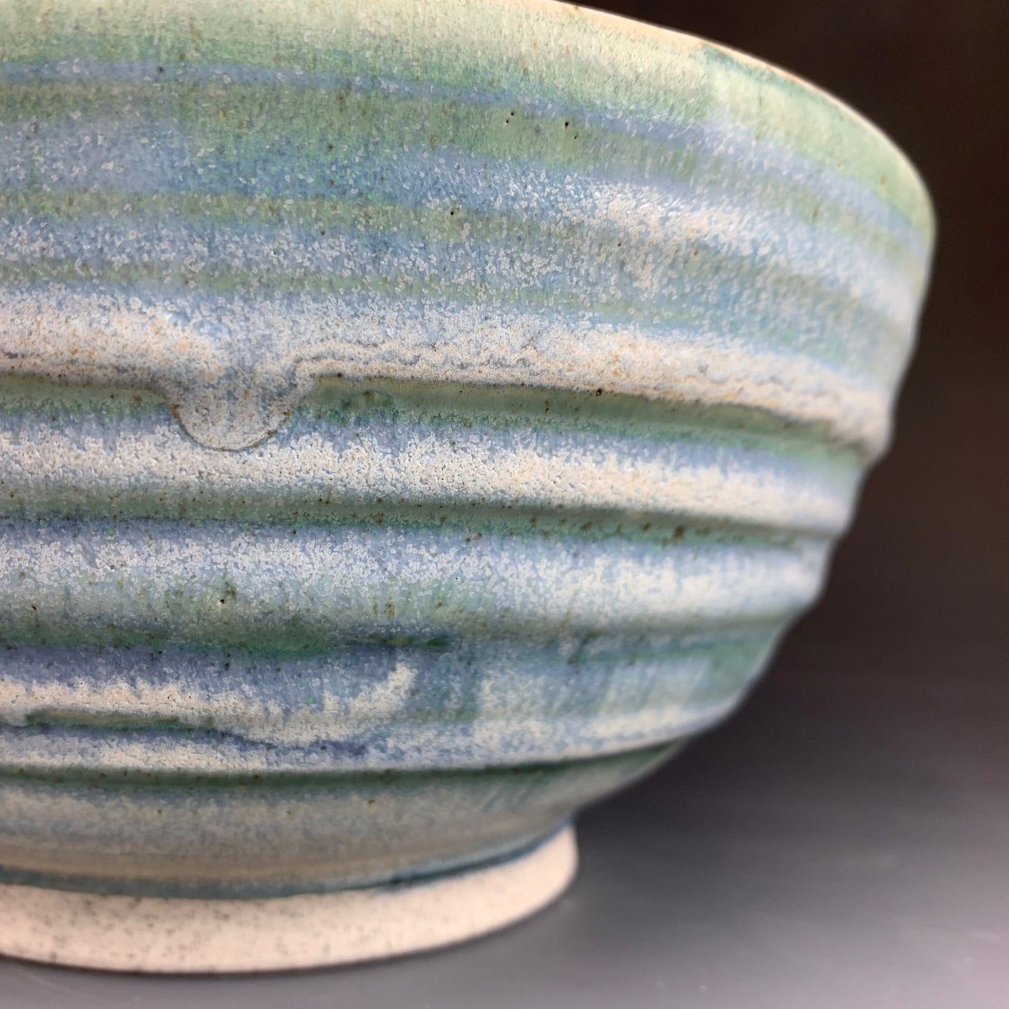 Detail of Blue Ramen Bowl on Dark Background