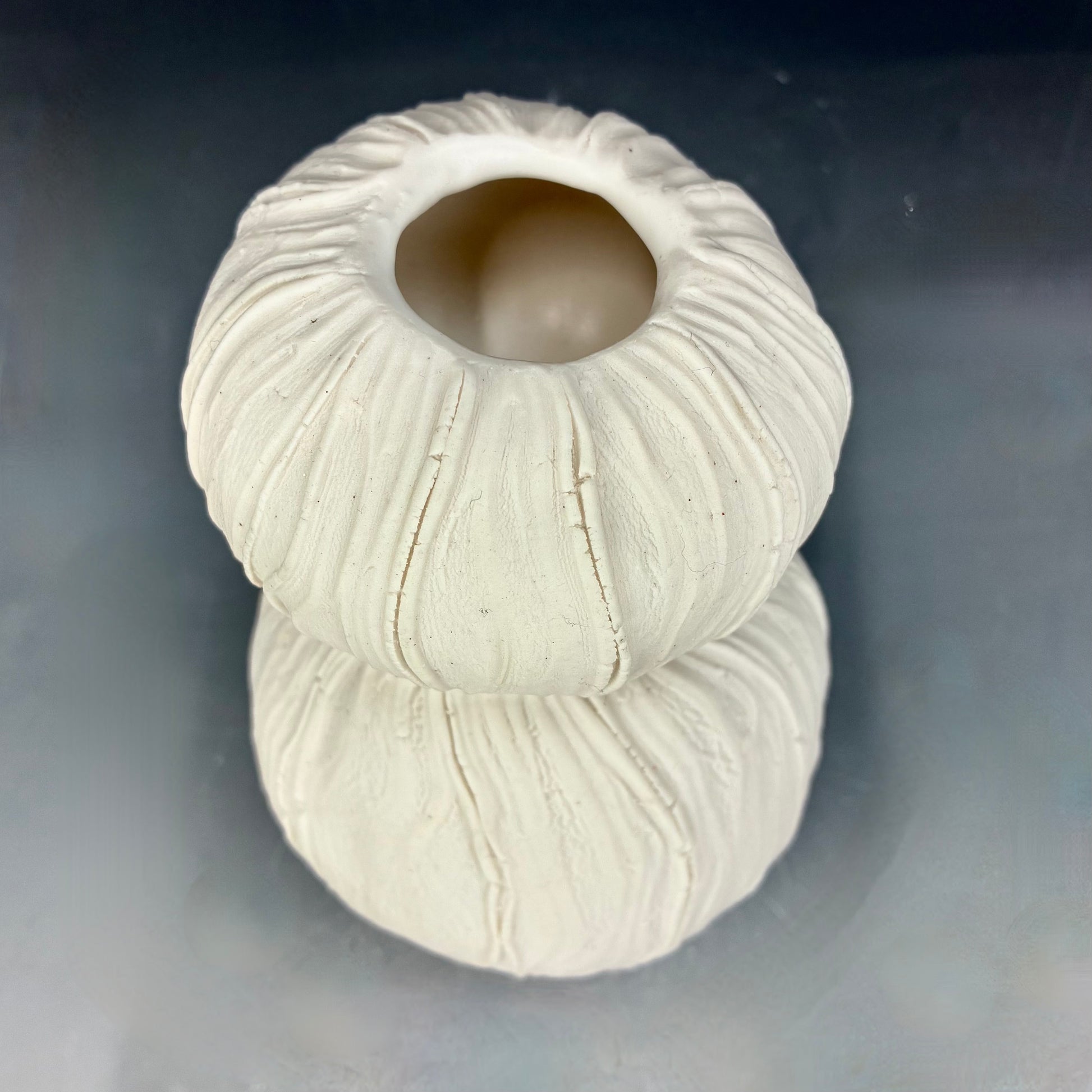 White textured vase on a gray background