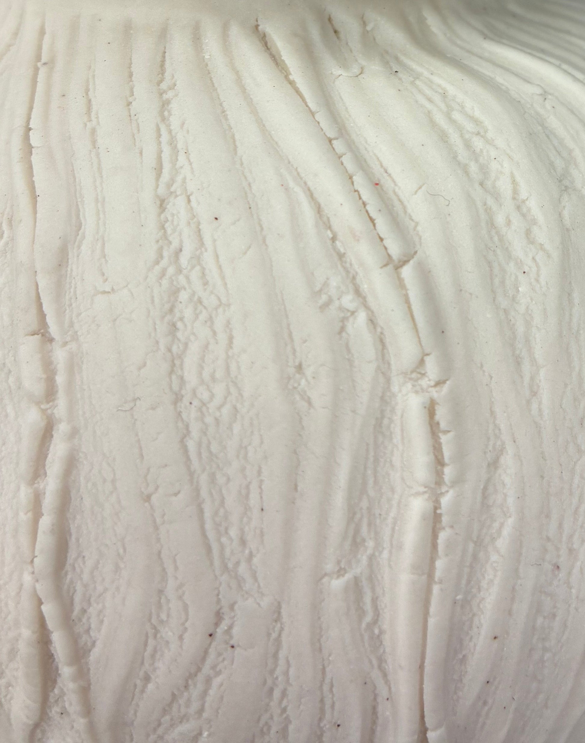 Close-up of a ball of white porcelain on a dark background